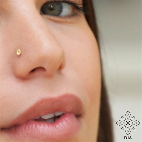 14k solid gold nose stud.